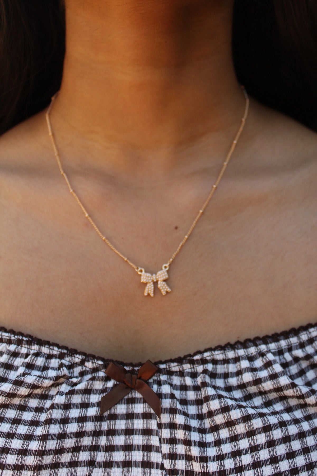 Gold Sparkle Bow Necklace